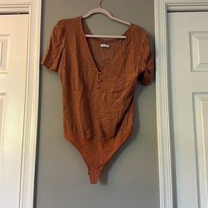 Burnt orange polka dot body suit